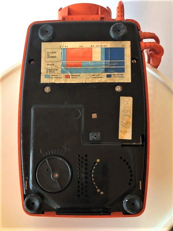 Orange Socotel phone with keys from the 70s 80s