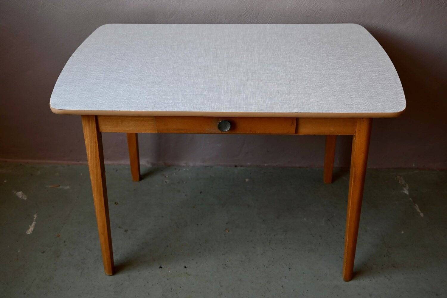 1950s Formica kitchen table with tapered legs and vintage drawer.