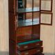 Set of three vintage hardwood military-style bookshelves.
