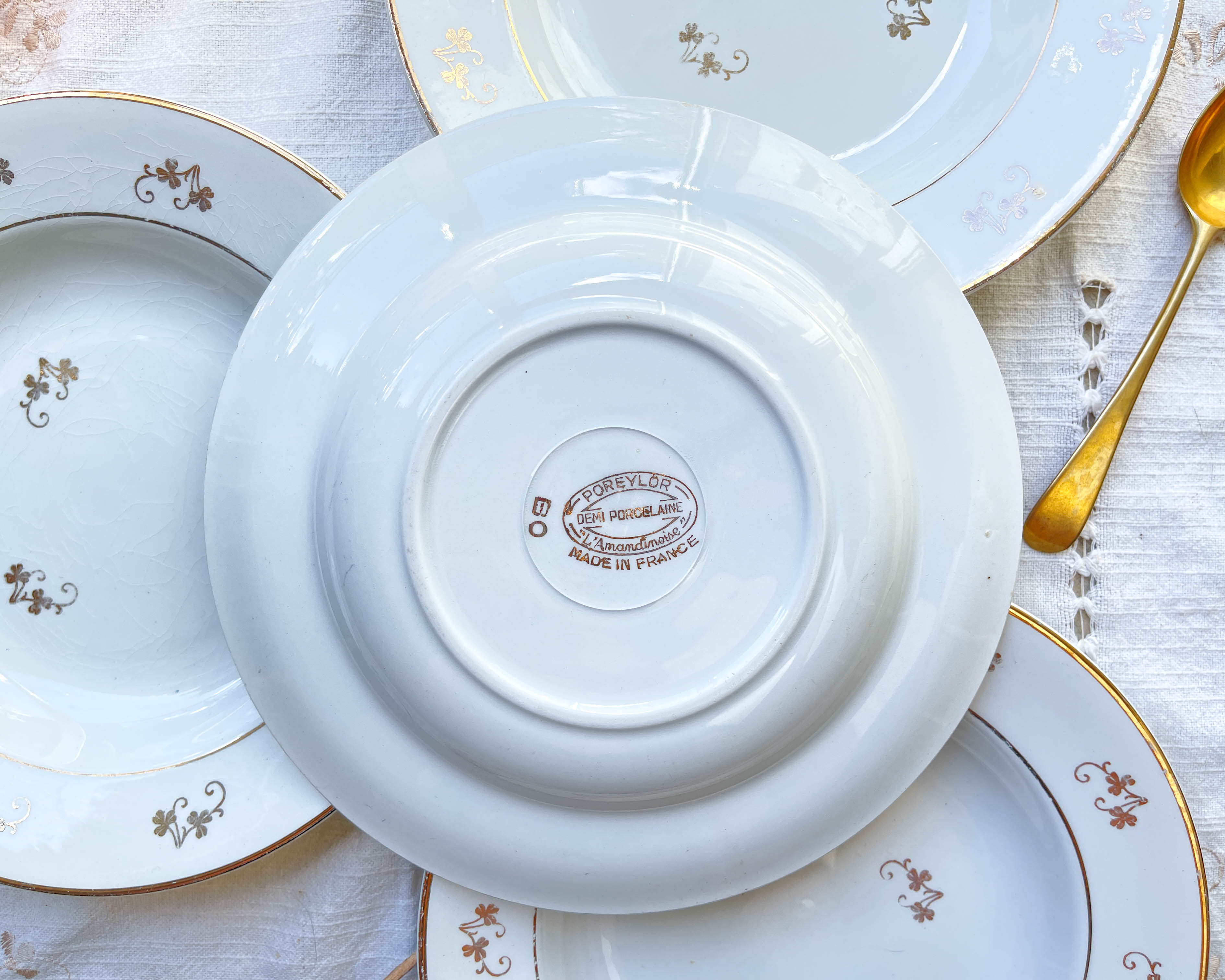 4 white porcelain L'Amandinoise soup plates with gold floral pattern