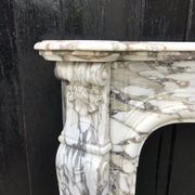 Cheminée en marbre brèche violette de style Louis XV