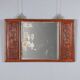 Antique mirror in exotic wood with chinoiserie carvings, 19th century.