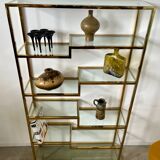 Old shelf in golden metal brass geometric library design 80s vintage