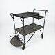 Perforated wrought iron rolling dessert trolley