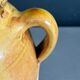 Ancient oil jar in glazed terracotta