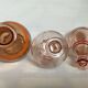 Trio of pink bottle decanters