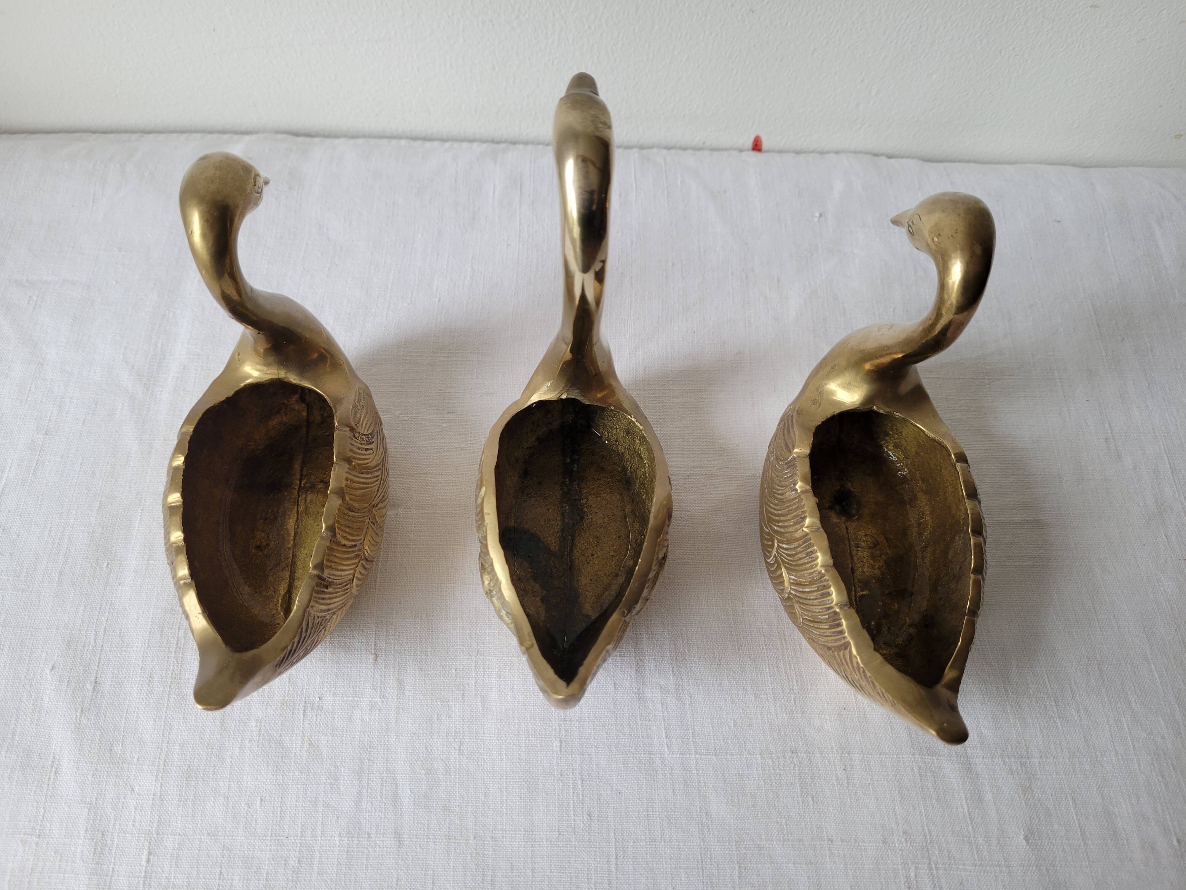 Trio of zoomorphic brass swan empty pockets