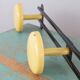 Yellow and black enamelled metal hook, 60s