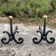 Massive wrought iron chenets from the 19th century topped with brass balls.
