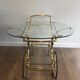 Neo classical style table in silver and gold metal and glass