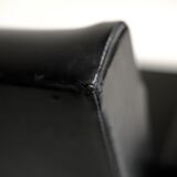 Pair of stainless steel, black leather-like armchairs, France, circa 1970