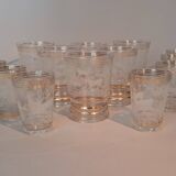 Service of 14 gold-plated and engraved glasses with a deer in the woods design from 1950