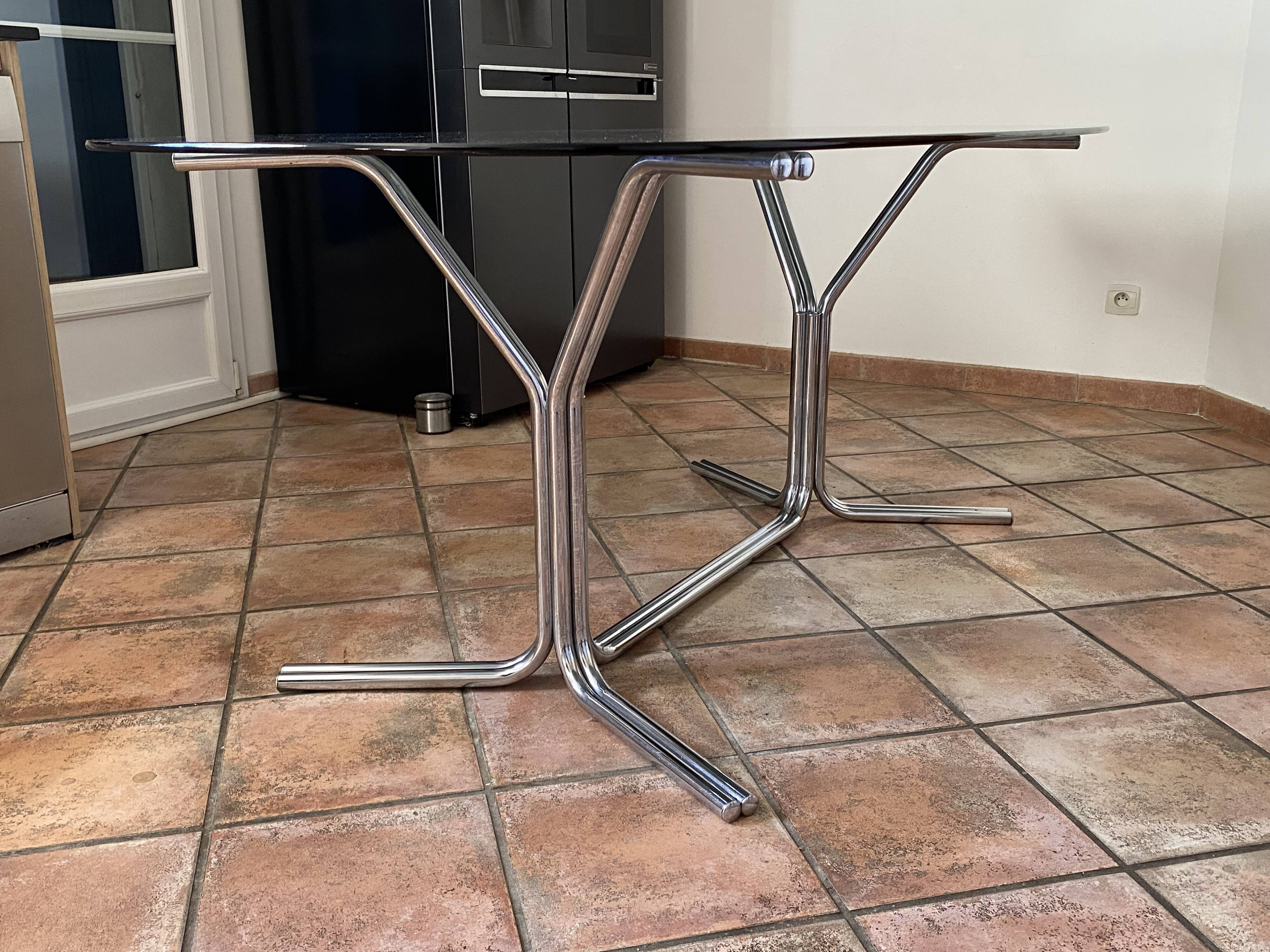 Oval table. 1970. Steel and smoked glass. 180x100