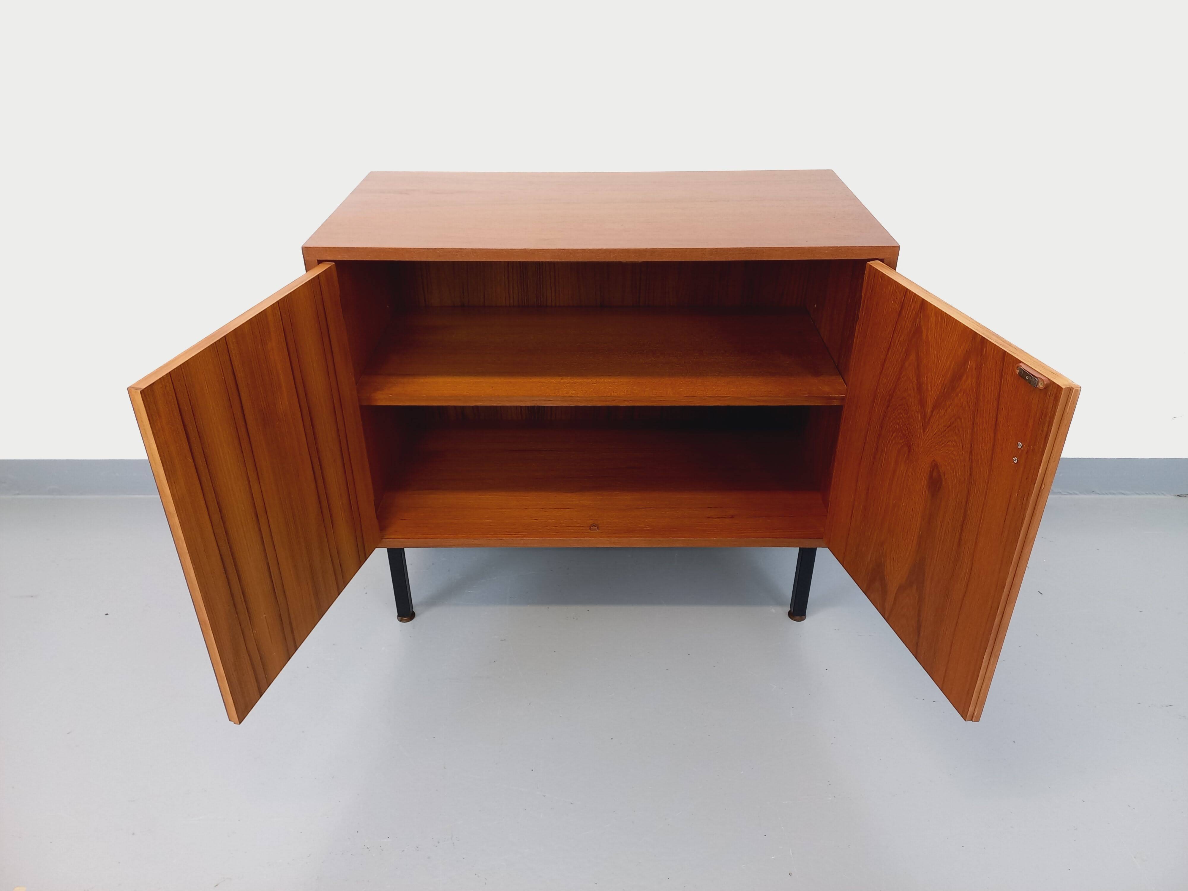 Small vintage storage unit in modernist Scandinavian style in teak from the 60s