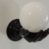 Paire d’appliques mains noires tenant un globe en opaline, années 70