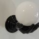 Pair of vintage 1970s wall sconces – Black hands holding an opaque globe