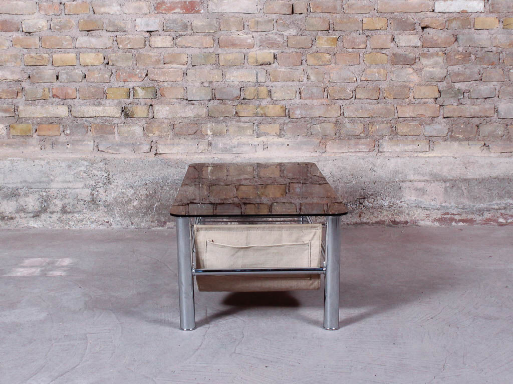 Glass rectangle coffee table with magazine rack, circa 1970