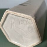 Faceted stoneware bottle signed La Cigogne, floral model (Diplotaxis muralis)