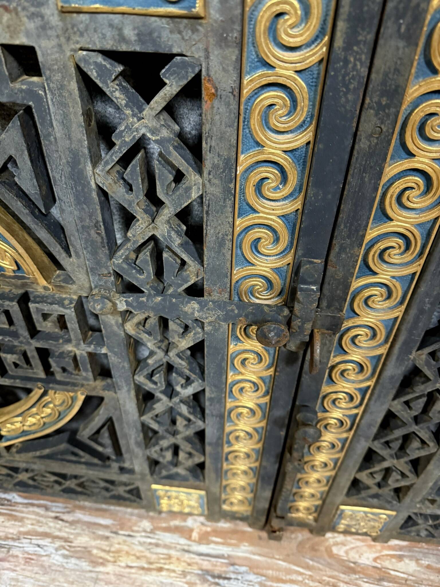 pair of monogrammed cast iron doors from the Art Deco period