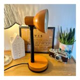 Orange articulated desk lamp