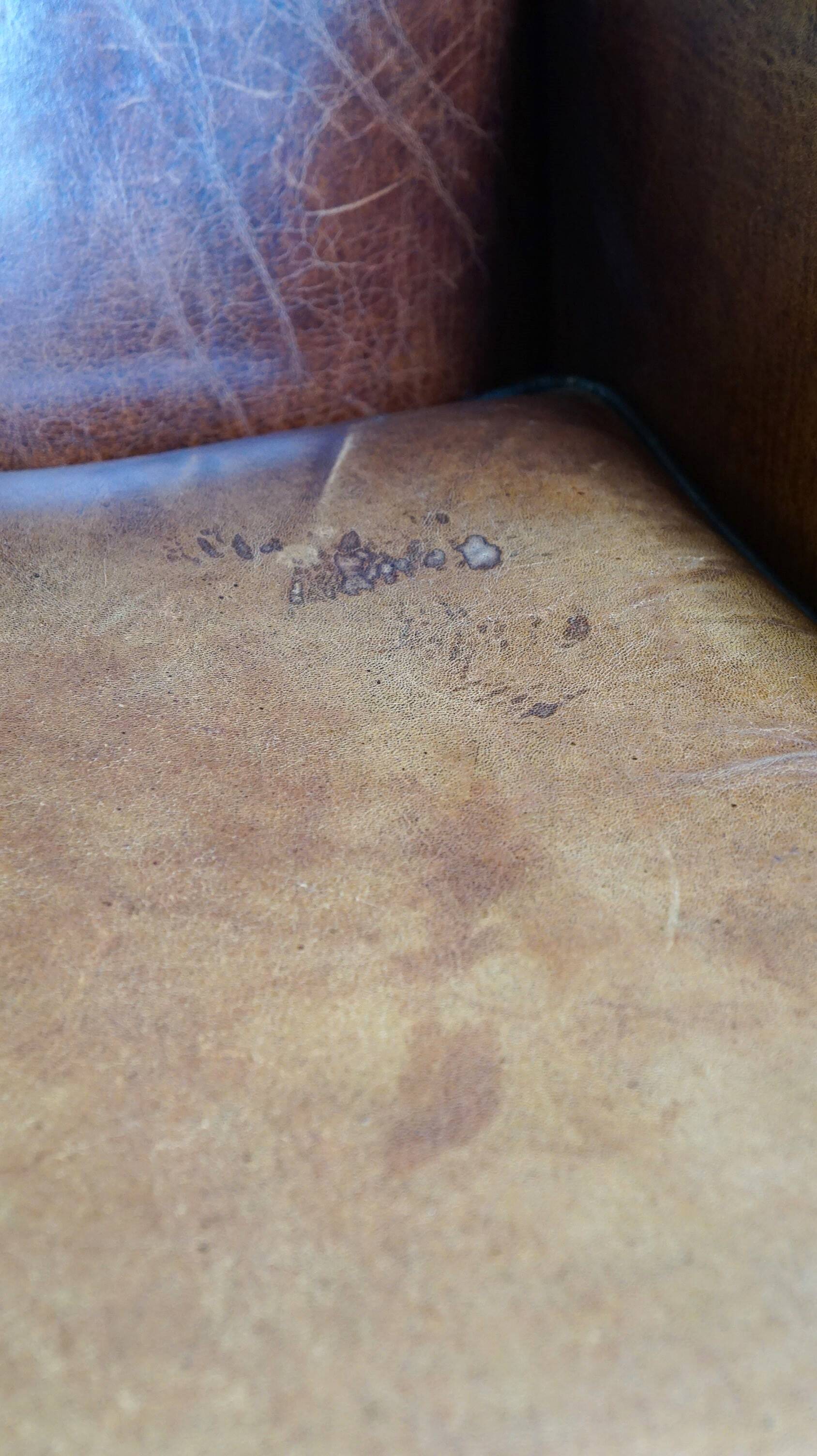 Sheepskin leather chair with a beautiful patina