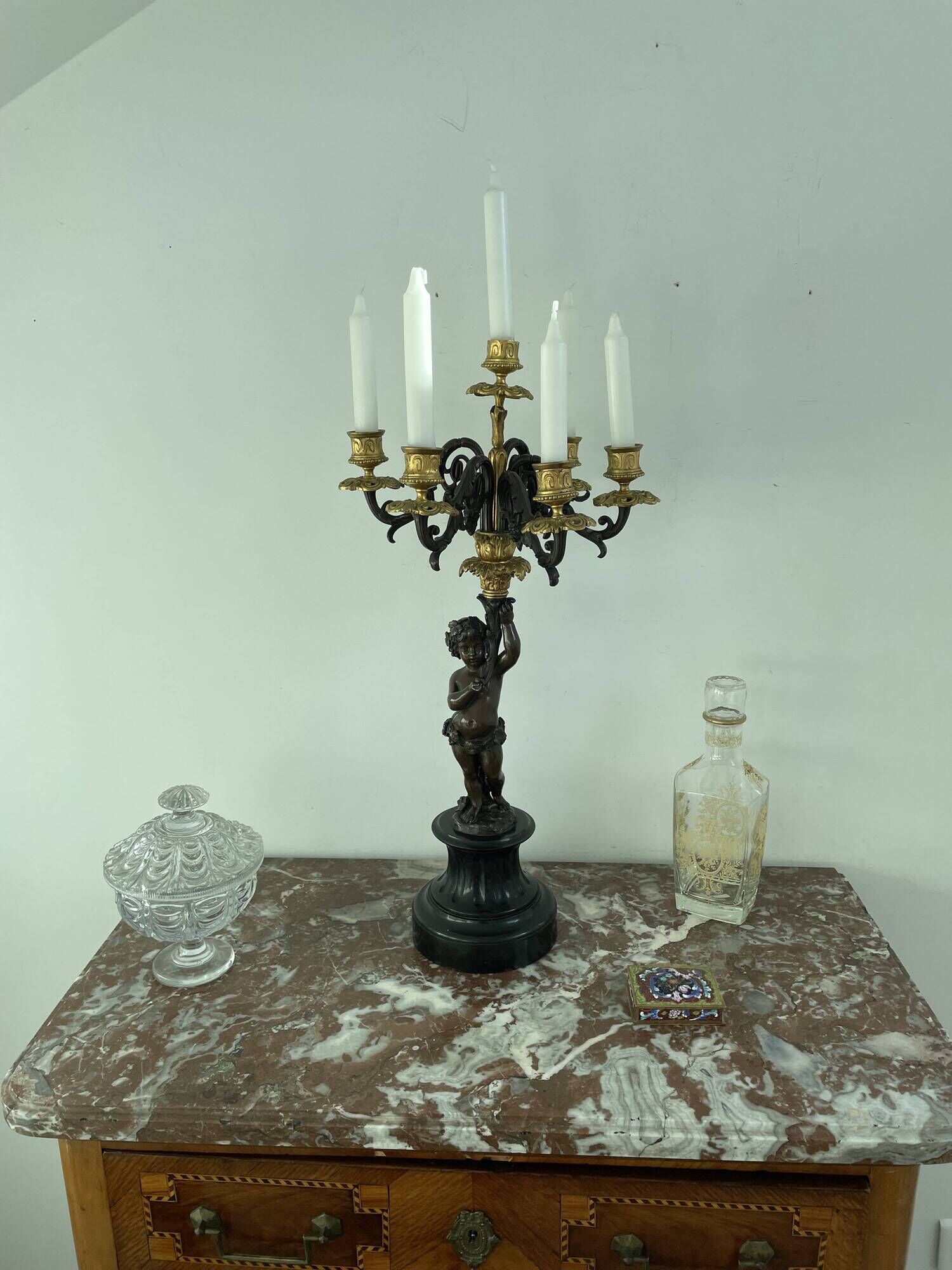 Candelabra with cherub in patinated bronze