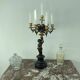 Candelabra with cherub in patinated bronze