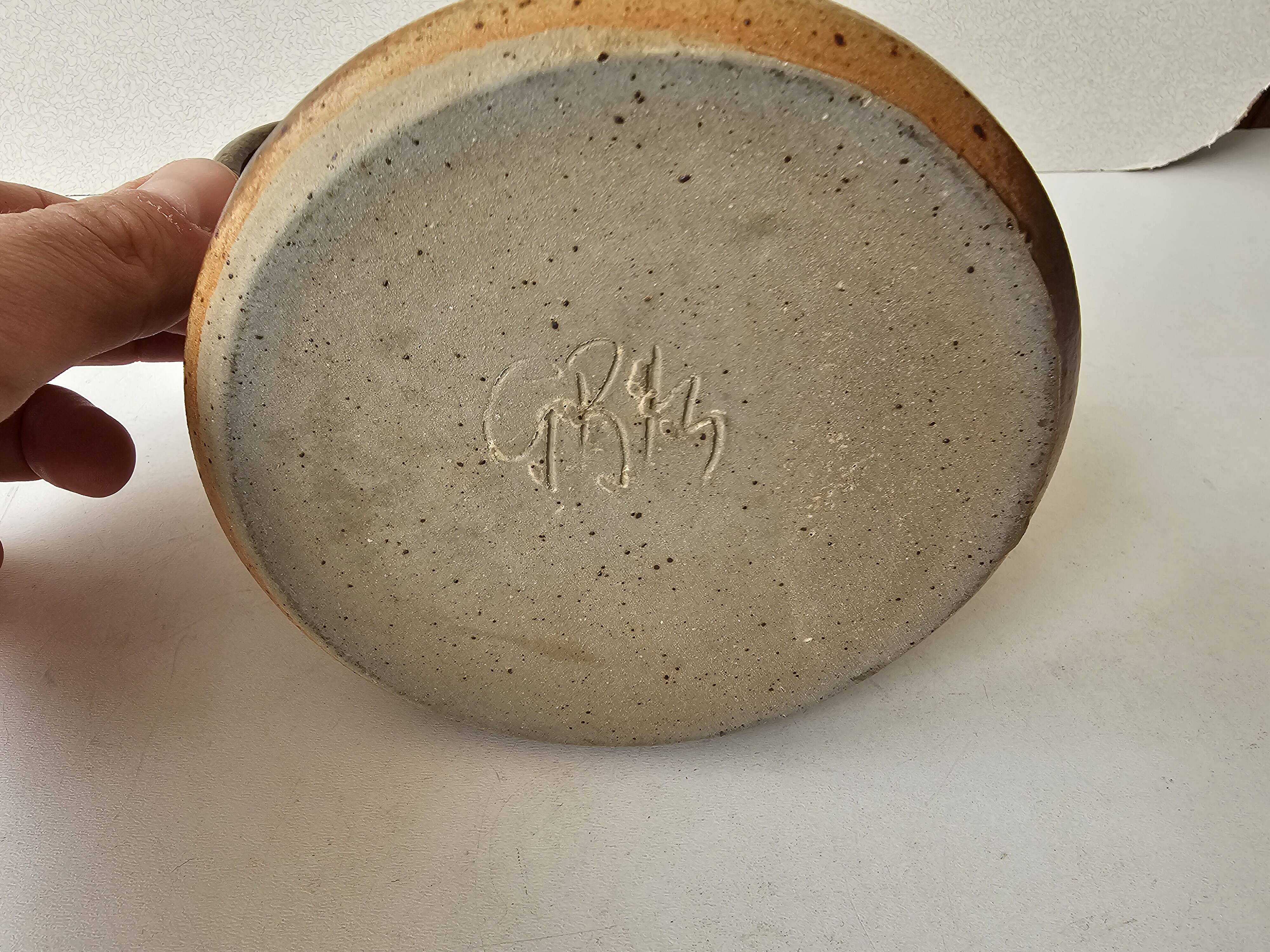 Pyrithed stoneware ceramic pitcher signed GRh. (signature to be identified)