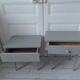 Duo of bedside tables, vintage mismatched verdigris end tables.