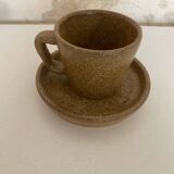 Set of stoneware coffee cups with saucers