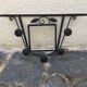 Wrought iron coat rack.