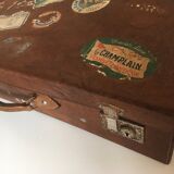 Suitcase of leather with labels of palaces