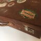 Suitcase of leather with labels of palaces