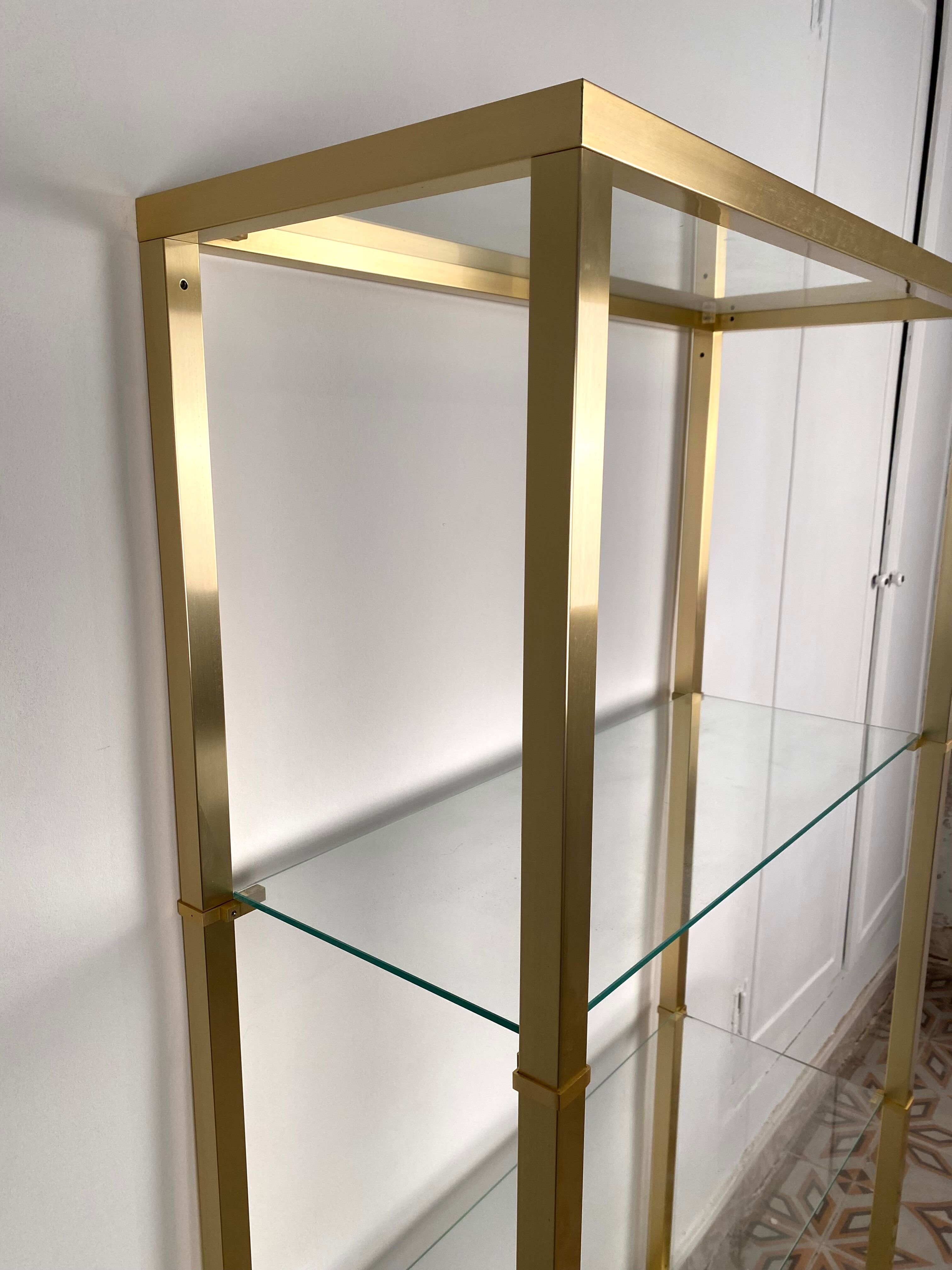 Bookcase in gilded metal and glass, Pierre Vandel Paris, circa 70