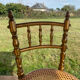 Children's chair in cane and curved wood