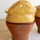 Pair of vintage wall planters in yellow glazed stoneware.