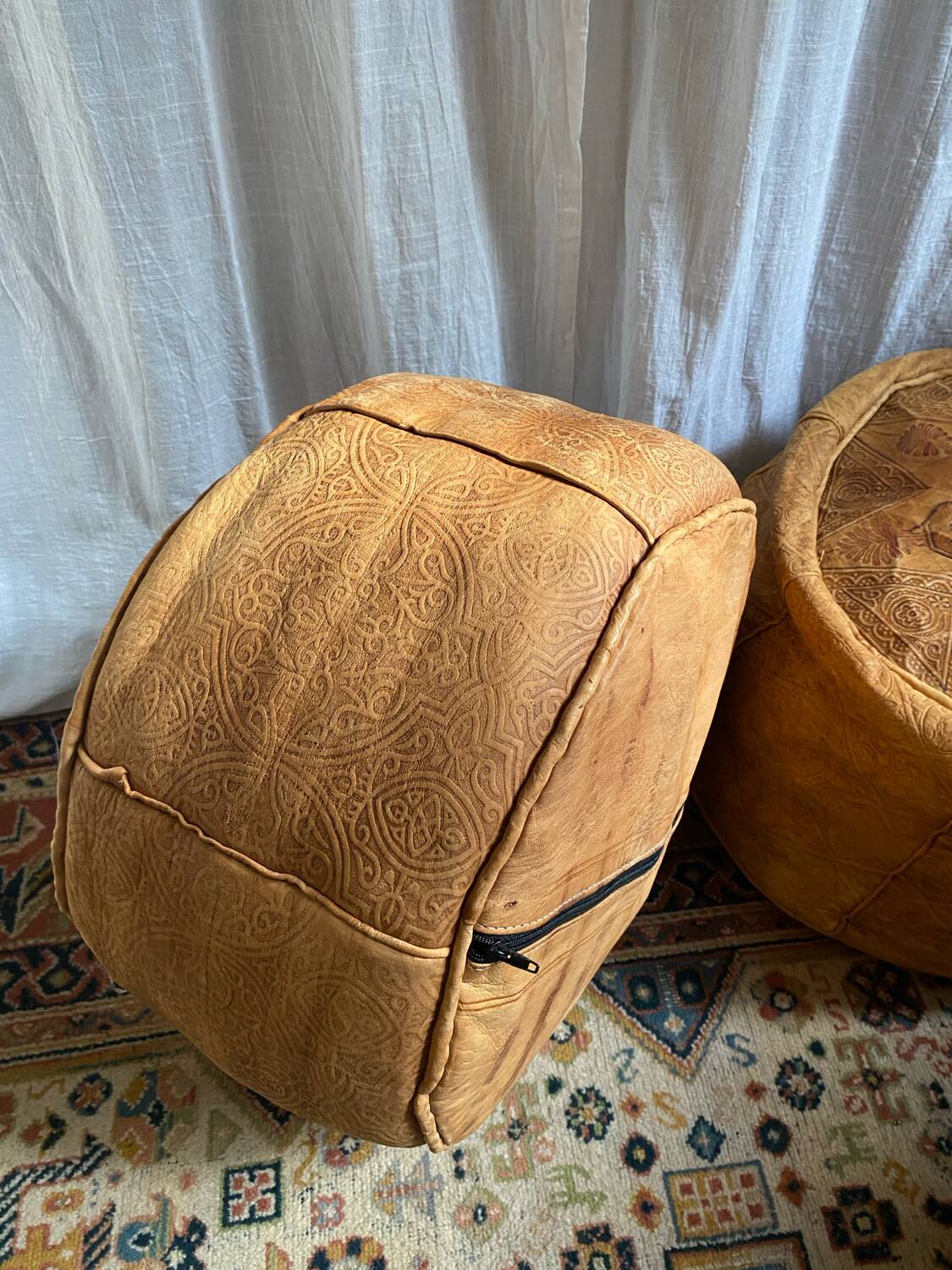Pair of leather poufs