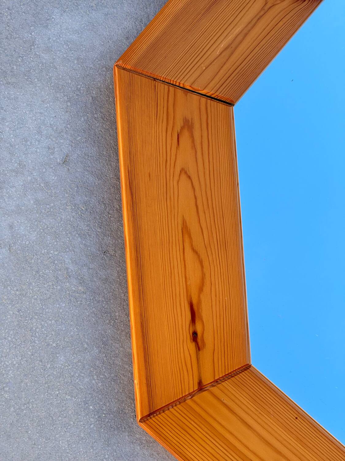Octagonal pine mirror in 1980s Scandinavian design.