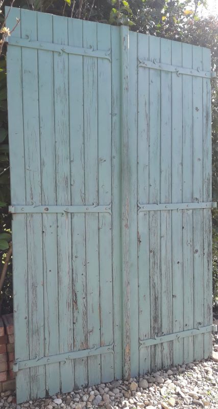 Pair of large wooden iron hanging shutters
