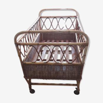 Vintage baby cradle in rattan with mattress