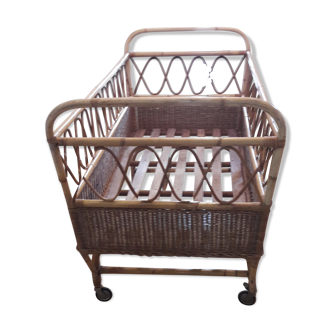 Vintage baby cradle in rattan with mattress