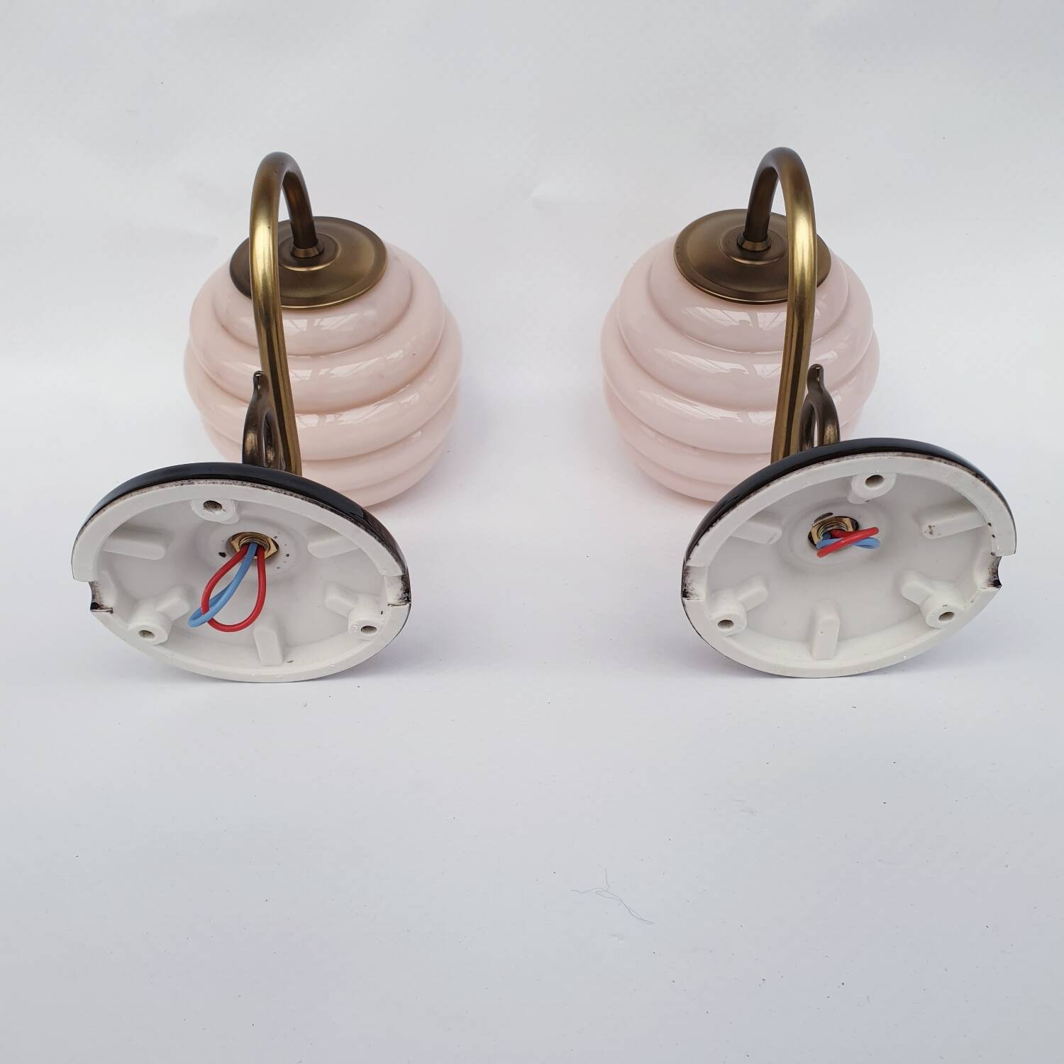Brass and glass swan neck wall lights