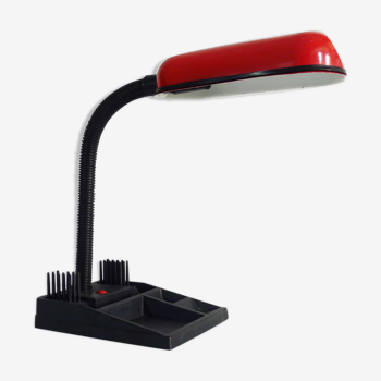 Former red and black flexible desk lamp with pencil door. Year 80