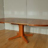 Oval walnut table with extension cords