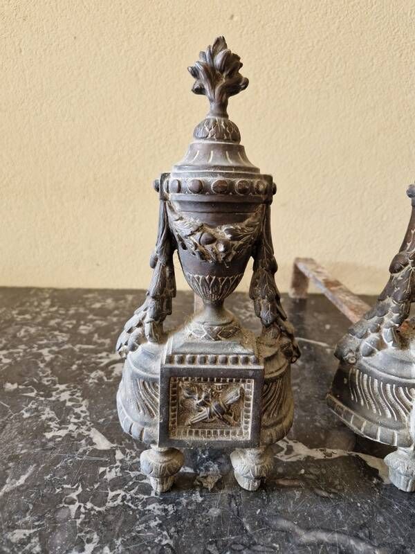 Pair of bronze andirons in Louis XVI style, late 19th century.