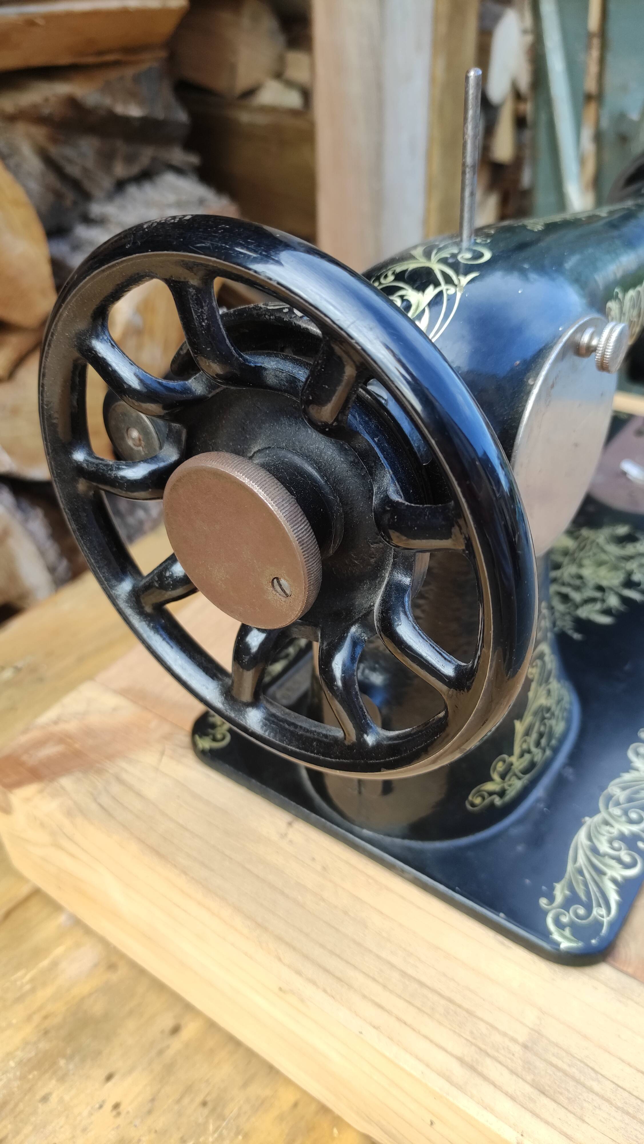 Old Singer sewing machine on pedestal