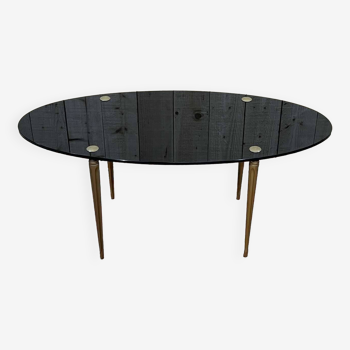 Oval coffee table from the 60s, brass-plated steel base and smoked glass top