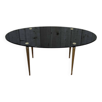 Oval coffee table from the 60s, brass-plated steel base and smoked glass top