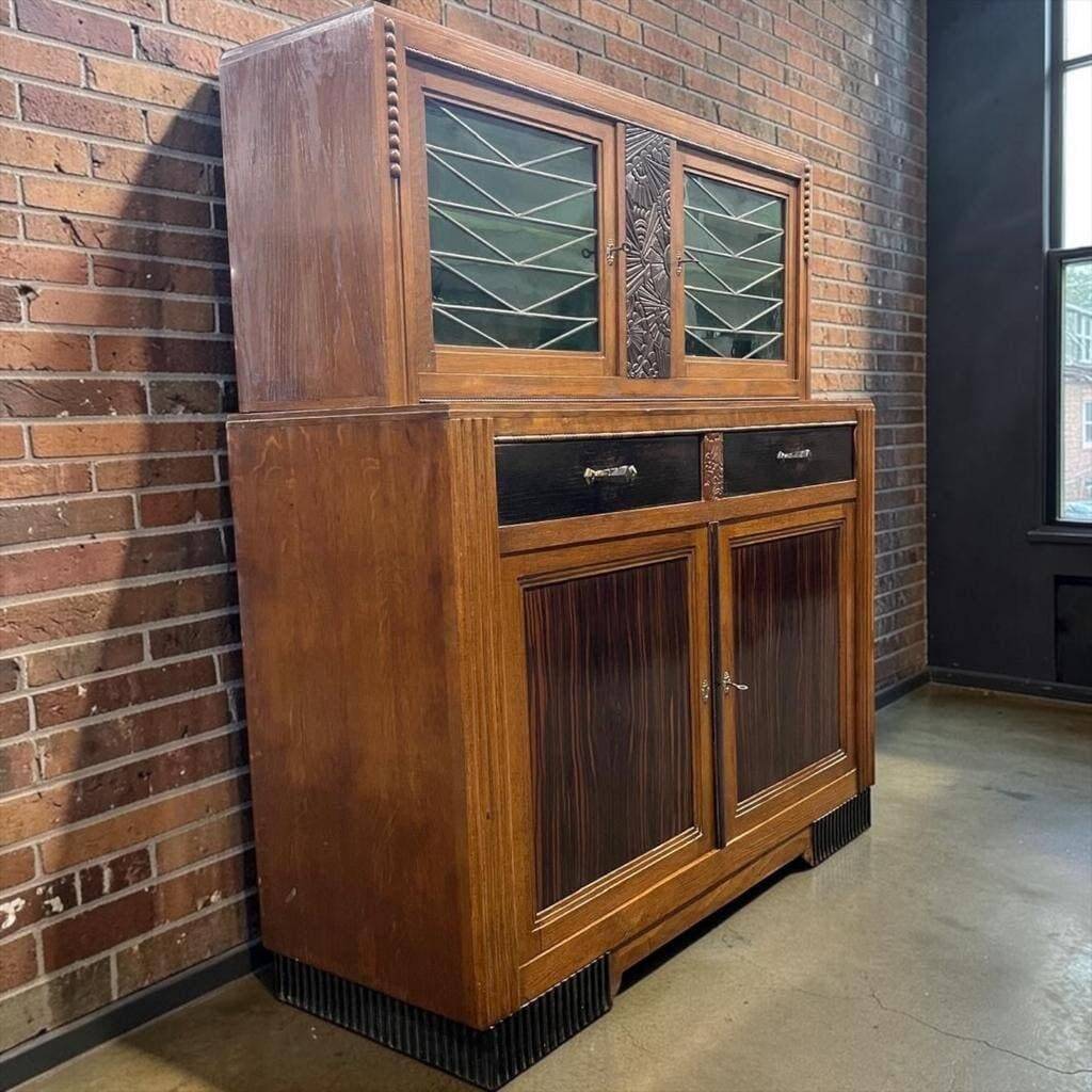Vintage Art Deco display cabinet in wood with green stained glass.