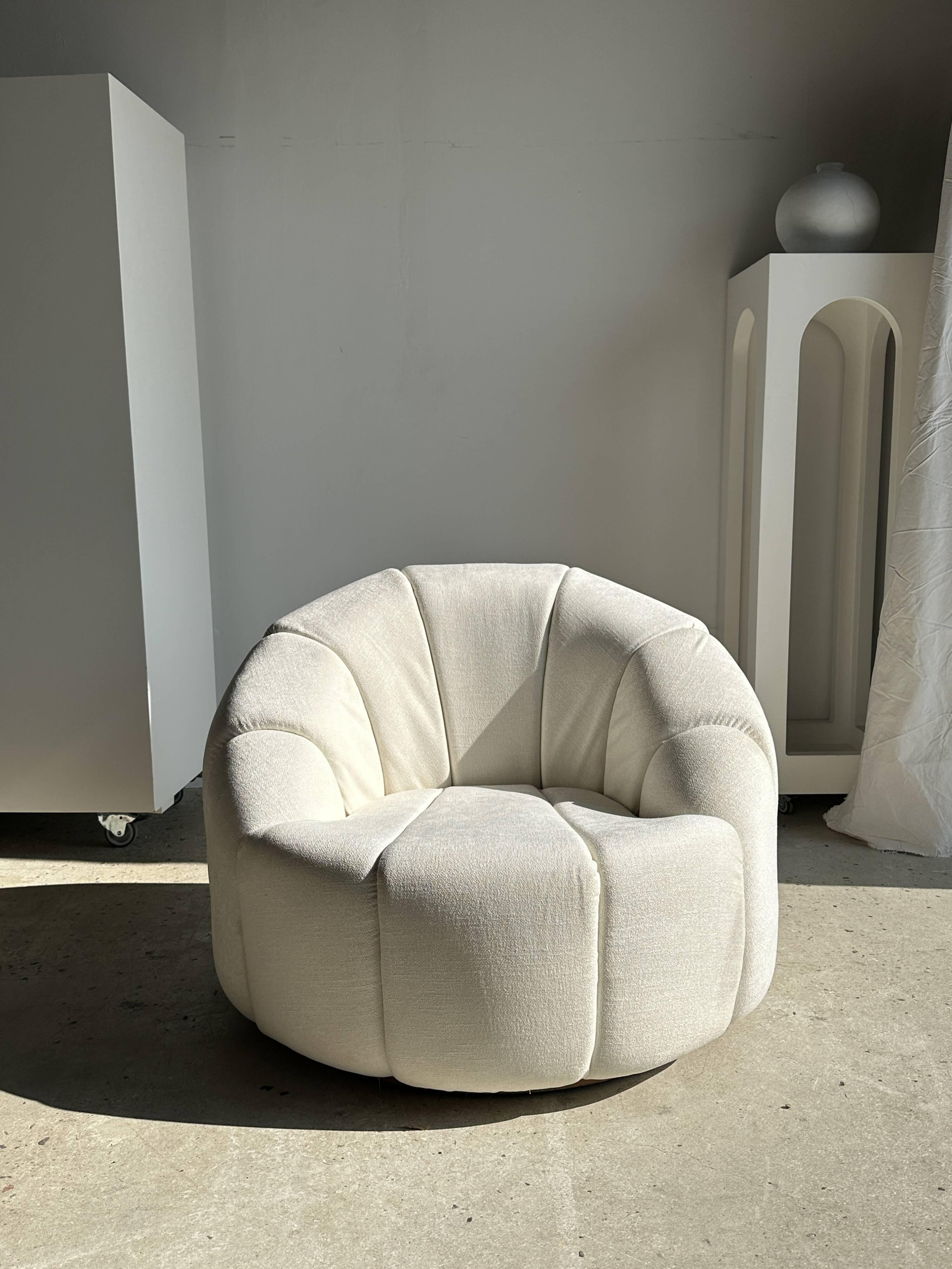 Large white circular armchair, white fabric upholstery